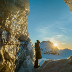 Hiker looking out from Katla Glacier