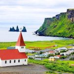 Vikurkirkja Church in Vik with Reynisdrangar behind