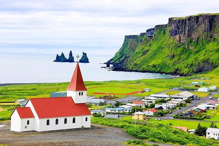 Vikurkirkja Church in Vik with Reynisdrangar behind