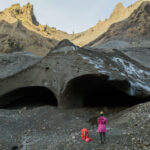 Hiker standing in front of Krossarjokull Ice Cave
