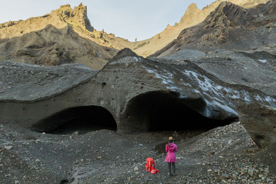 Hiker standing in front of Krossarjokull Ice Cave