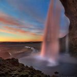 Seljalandsfoss Waterfall from behind in Iceland