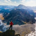 Hiker standing high above in Thorsmork (Valley of Thor)