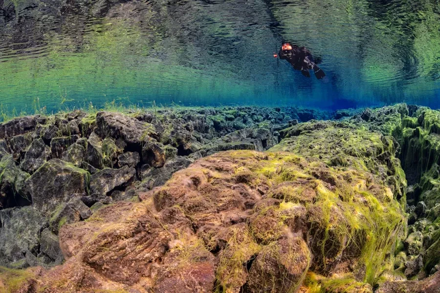 Iceland Snorkeler in Silfra Fissure within the Tectonic Plates