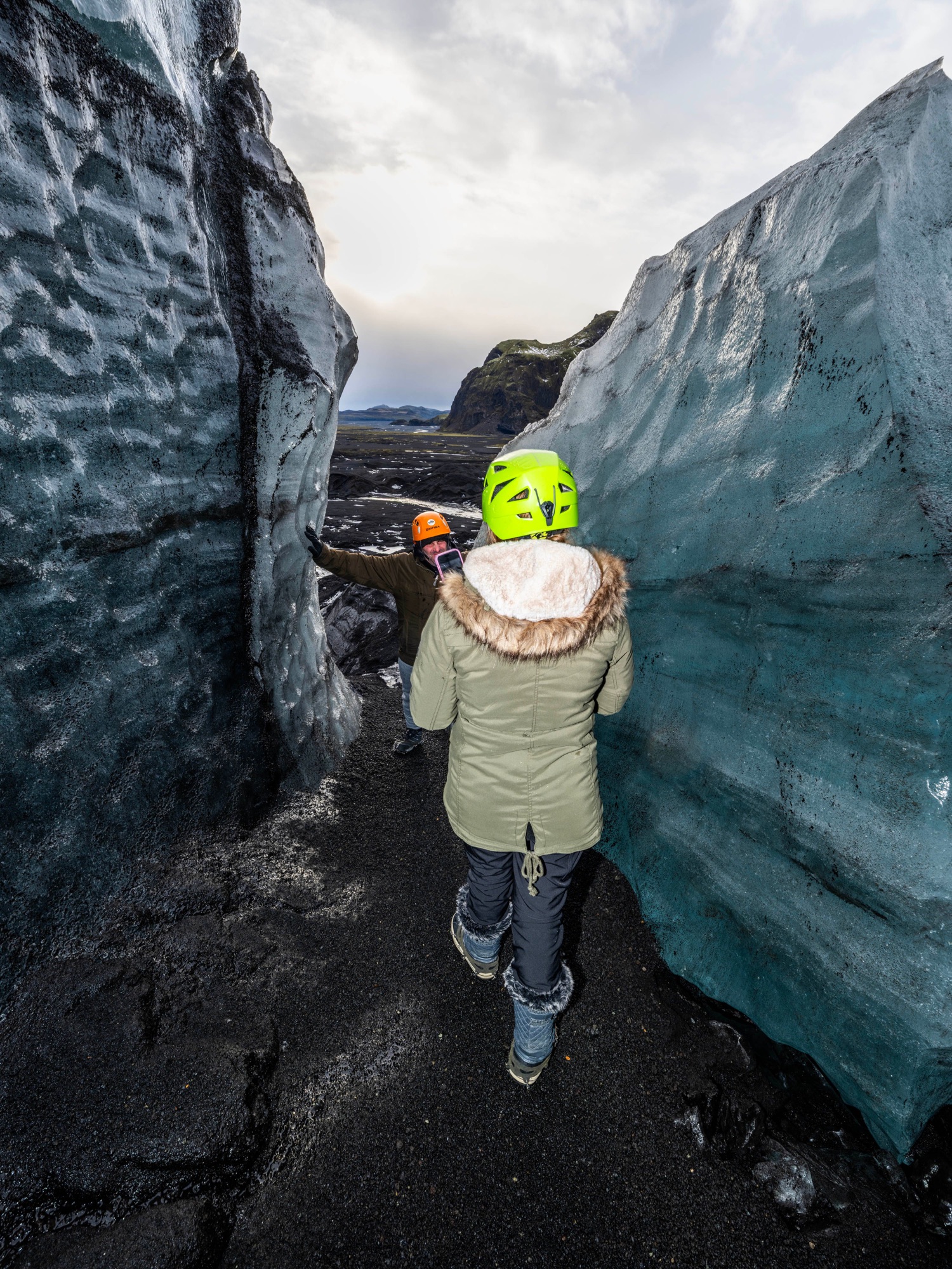 Walking through Ice Formations at Katla Ice Cave